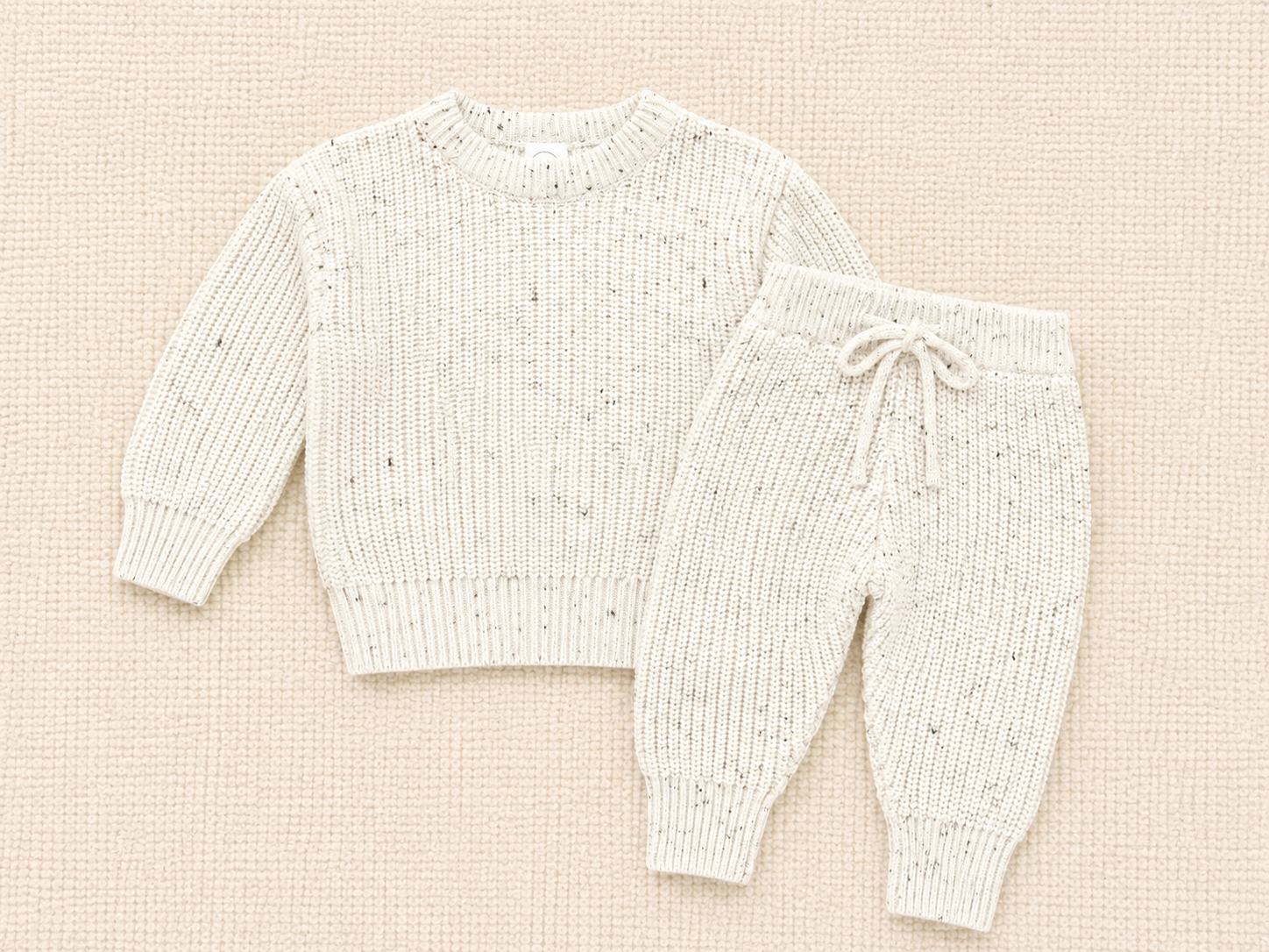 Cream speckle knit chunky sweater and matching jogger pants, a warm, polished two-piece set for chilly days.