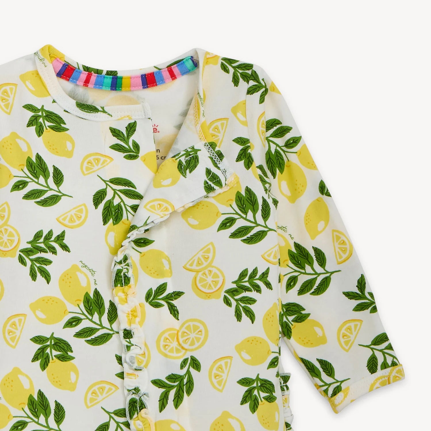 Baby onesie with lemon pattern on a white background