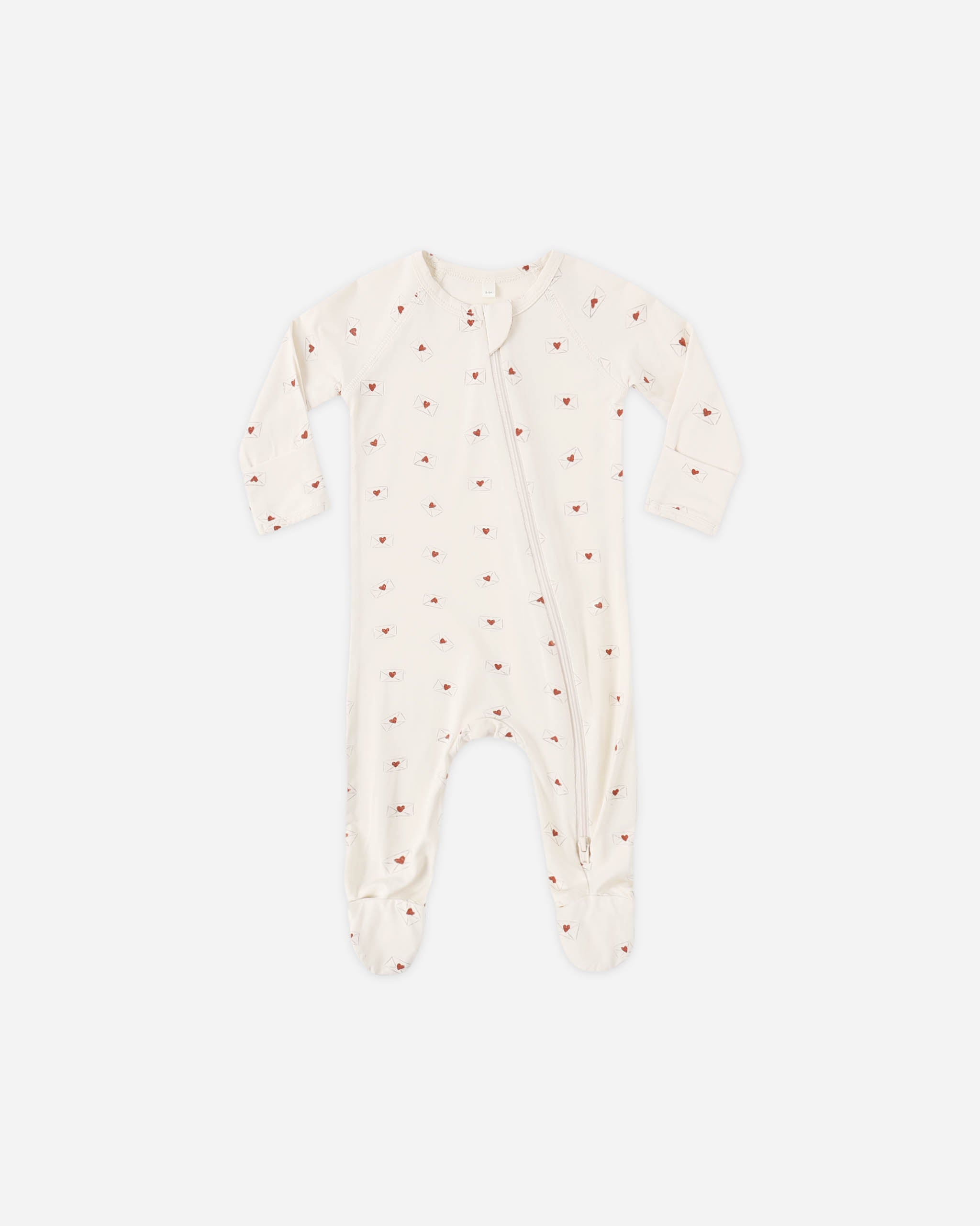 Baby onesie with red polka dots on a white background