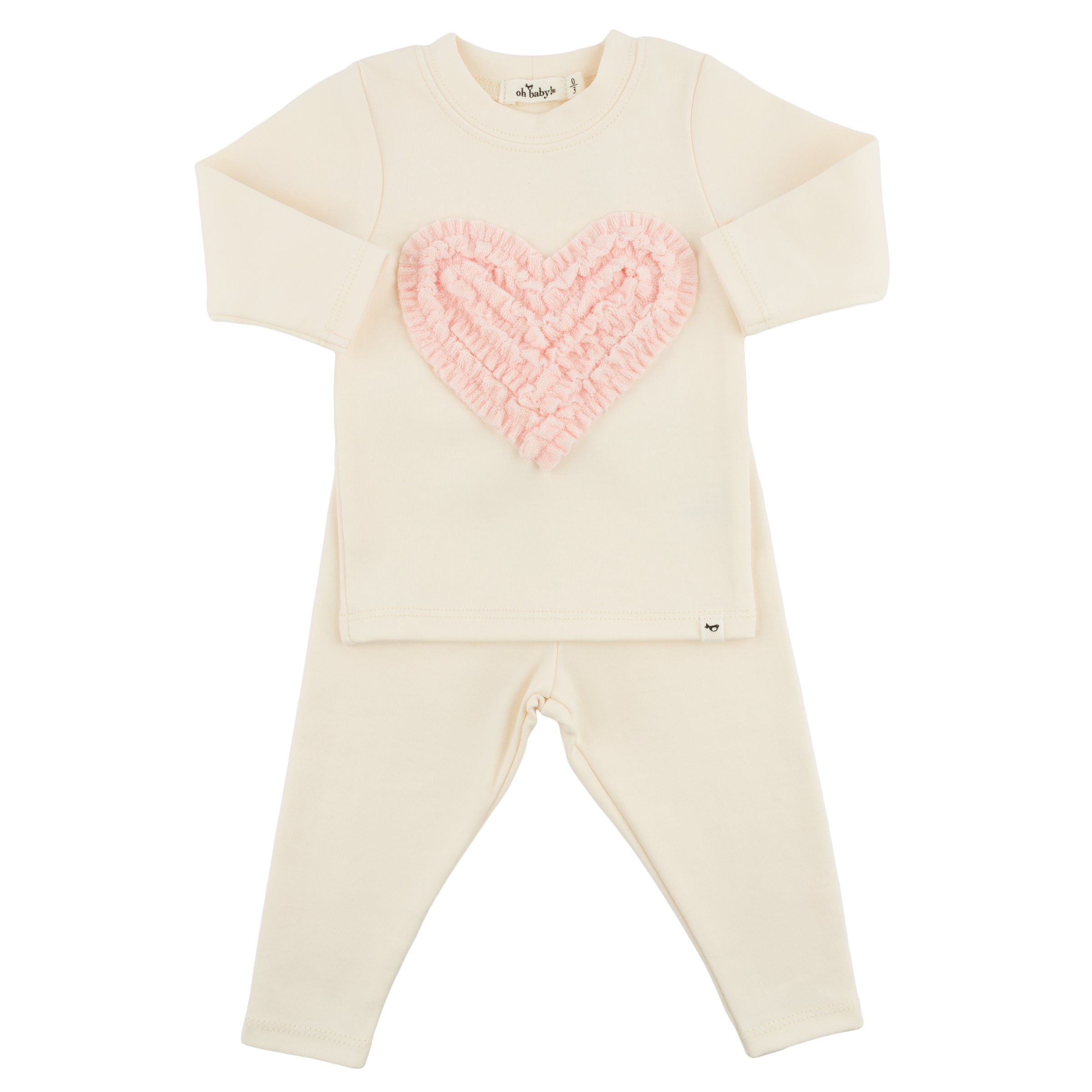 Cream-colored outfit with a pink heart design on a white background