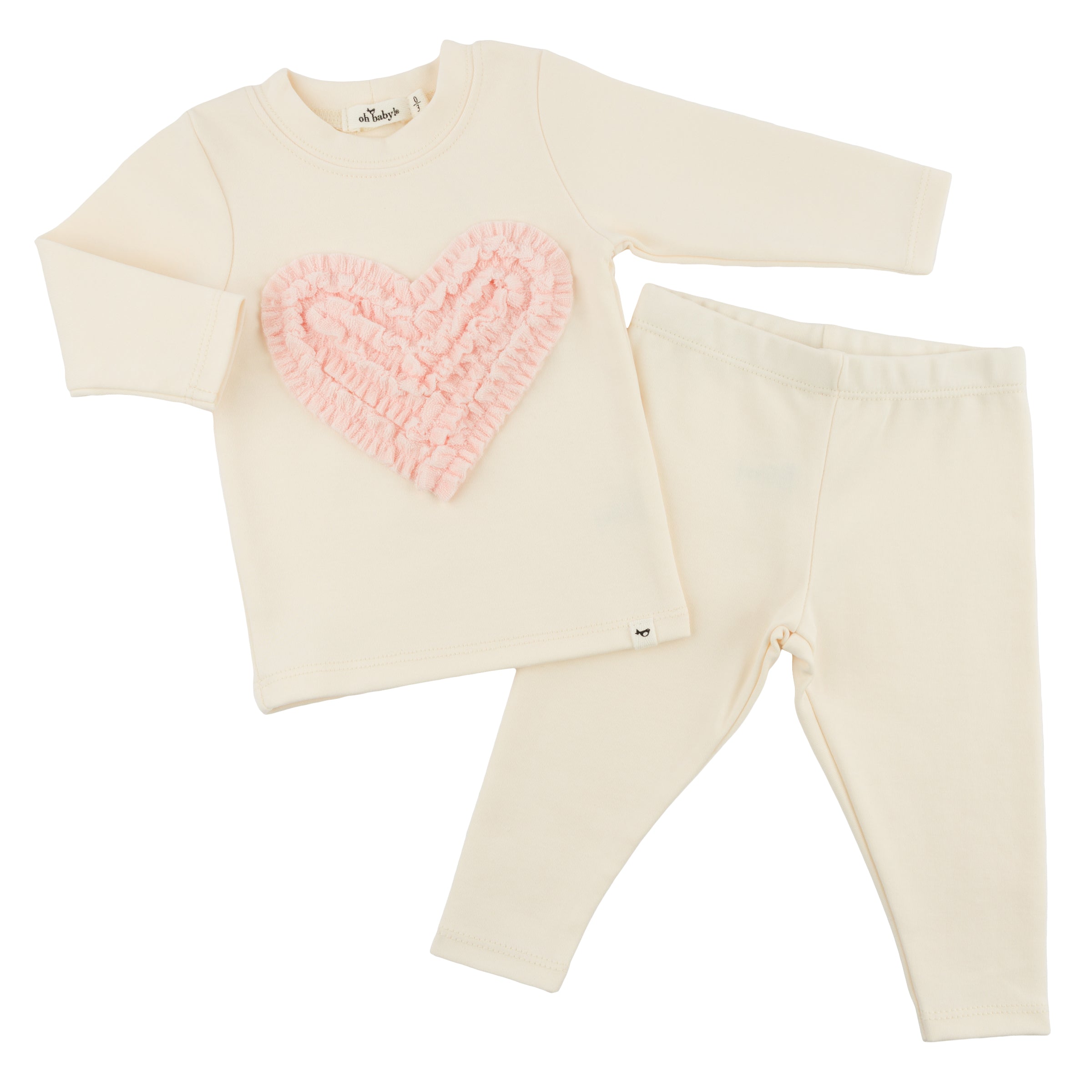 Cream-colored outfit with a pink heart design on a white background