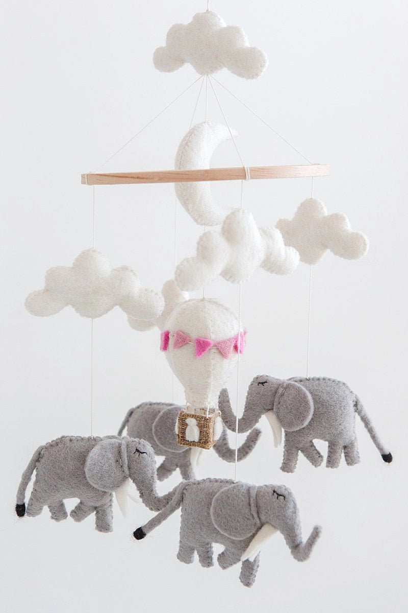 Nursery mobile with elephants and a cloud on a white background