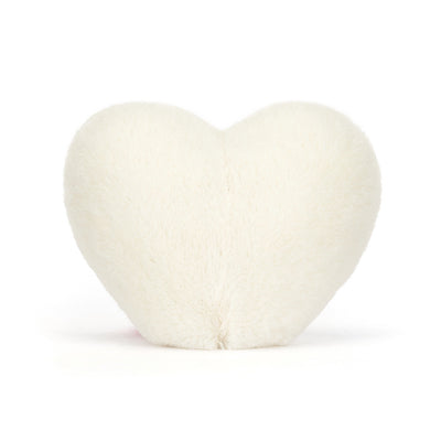 Heart-shaped white pillow on a white background