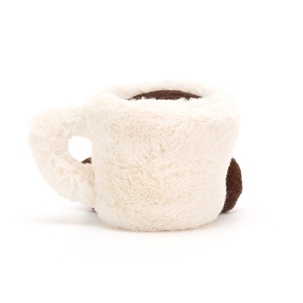 White plush toy with brown accents on a white background
