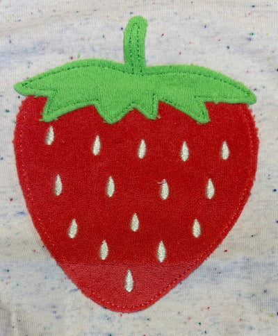 Embroidered strawberry patch on a fabric background
