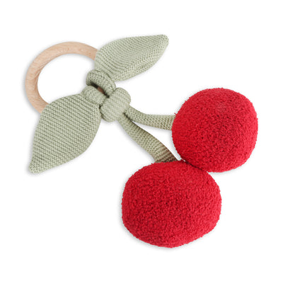 Knitted cherry teething ring with wooden base on a white background