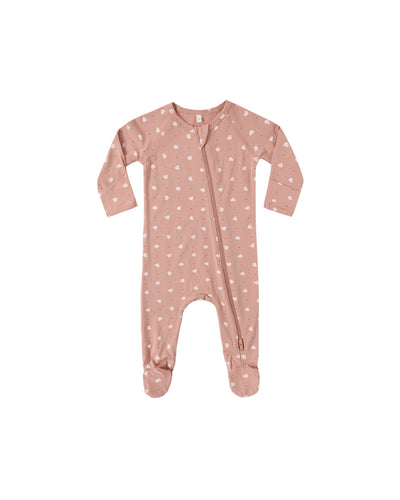 Pink baby onesie with white patterns on a white background
