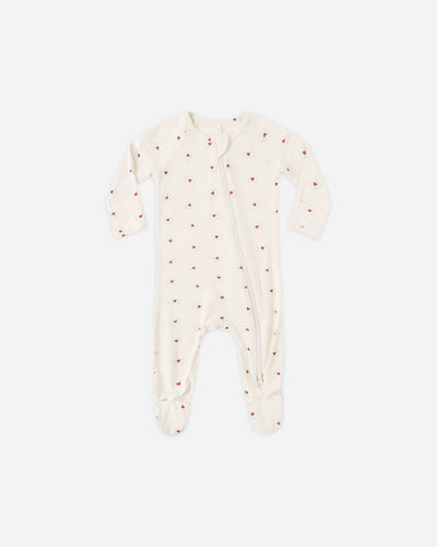 Baby onesie with red polka dots on a white background