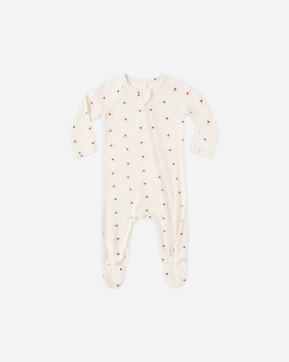 Baby onesie with red polka dots on a white background