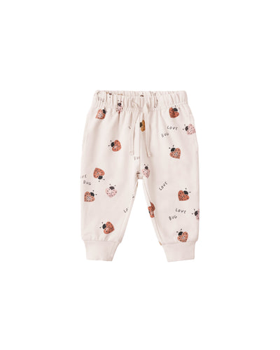 Baby pants with ladybug pattern on a white background