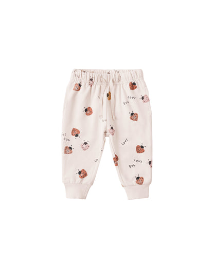Baby pants with ladybug pattern on a white background