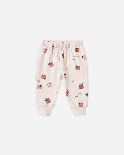 Baby pants with ladybug pattern on a white background