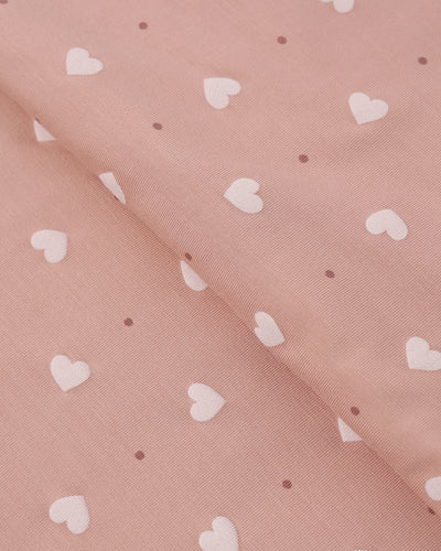 Pink fabric with white heart pattern