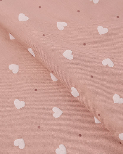Pink fabric with white heart pattern