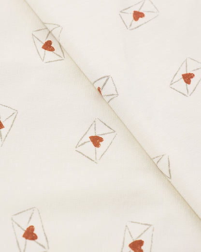 White fabric with red heart and white envelope pattern