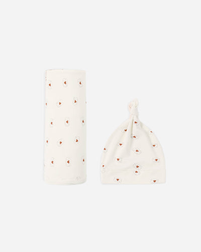 Two baby blankets with heart patterns on a white background