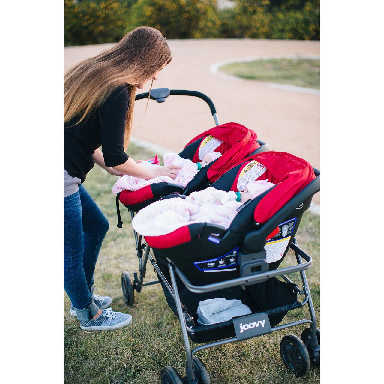 Twin stroller with infant car outlet seats