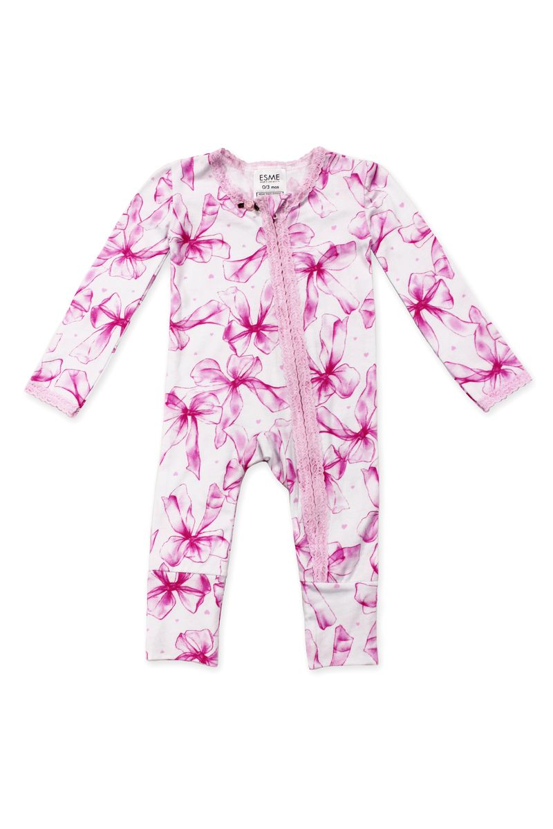 Tulle bow patterned baby onesie on a white background