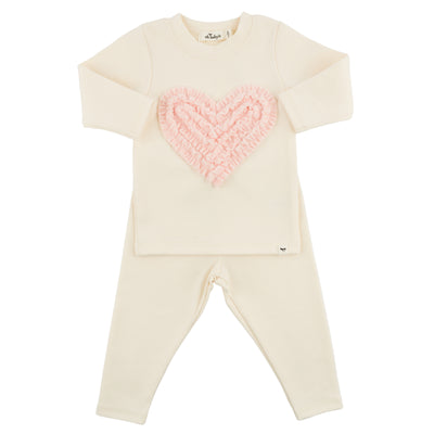 Cream-colored outfit with a pink heart design on a white background