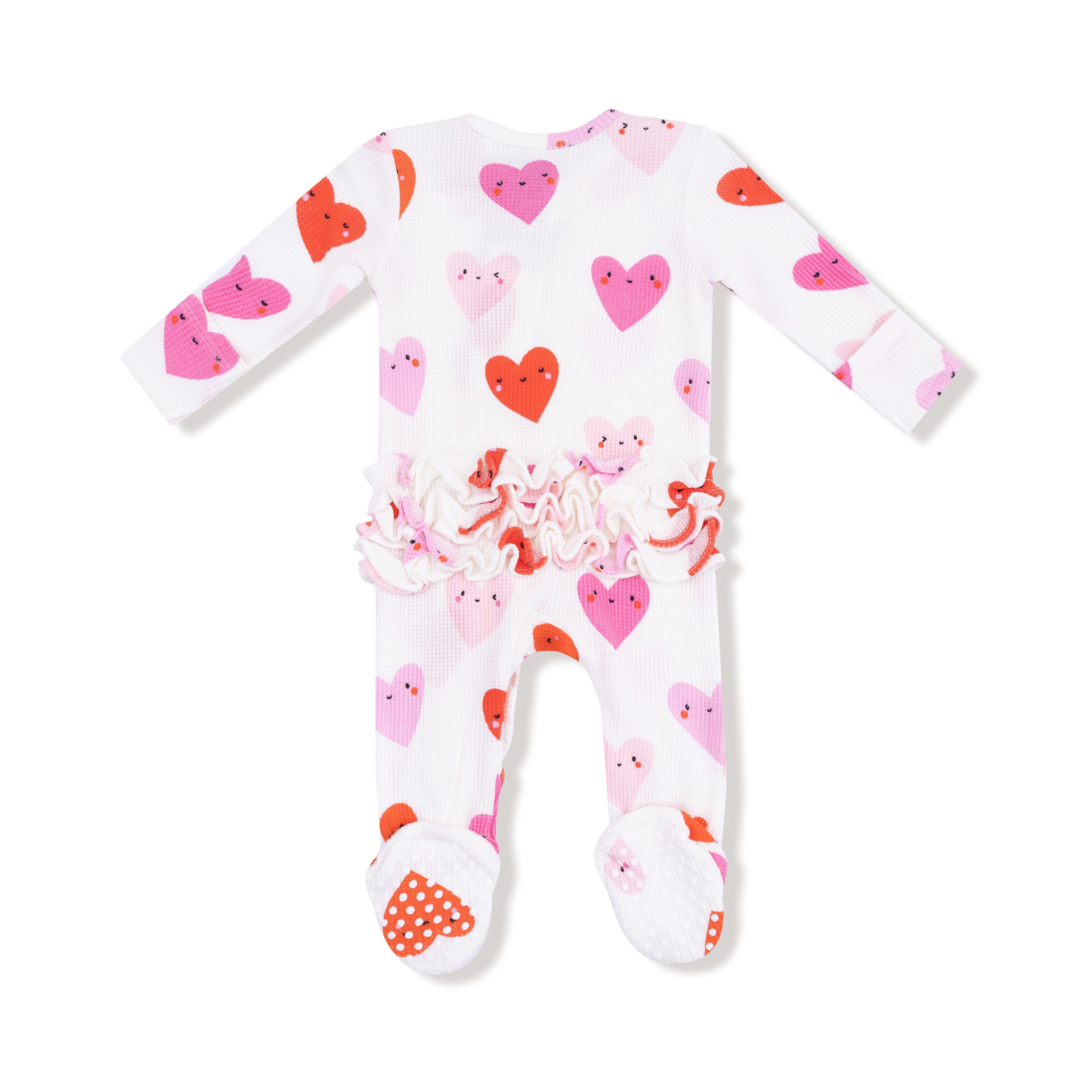 Baby onesie with heart pattern on a white background