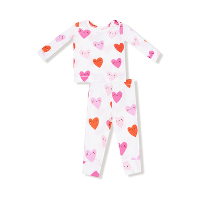 Children's two piece loungewear set with heart pattern on a white background