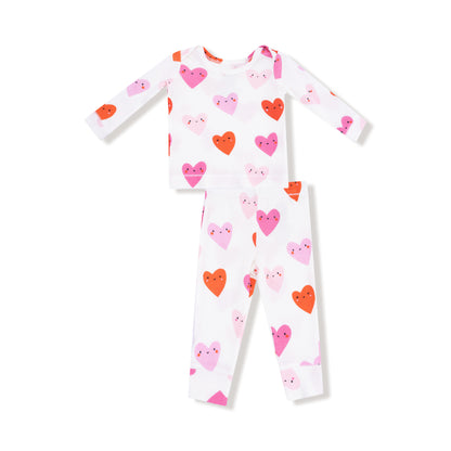 Children's two piece loungewear set with heart pattern on a white background