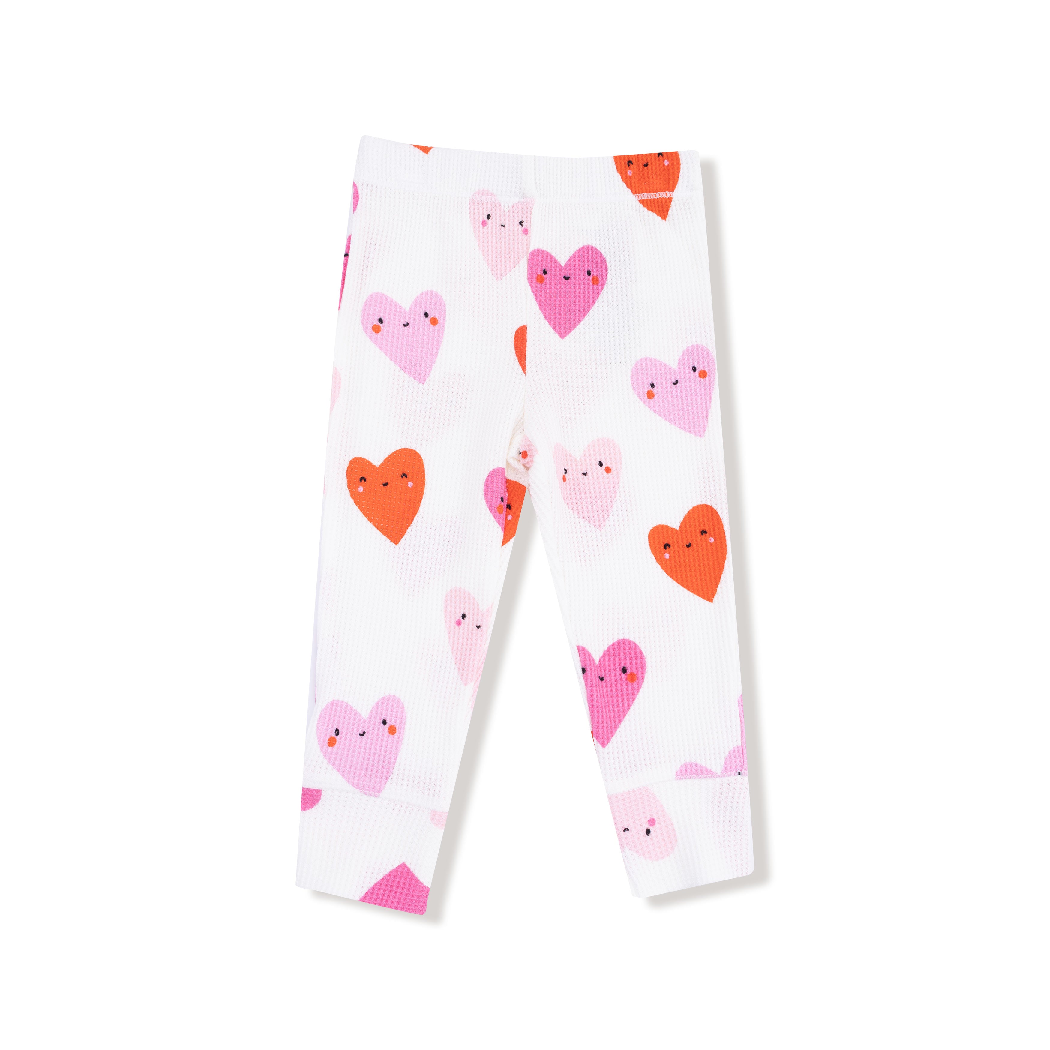 White leggings with pink and orange heart patterns on a white background